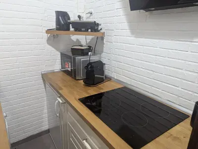 a kitchen with a counter top with a coffee maker at Imperial House San Calisto 7 in Rome