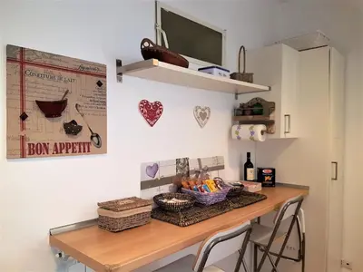 a room with a table with a basket of food at Il Salotto di via Giulia in Rome