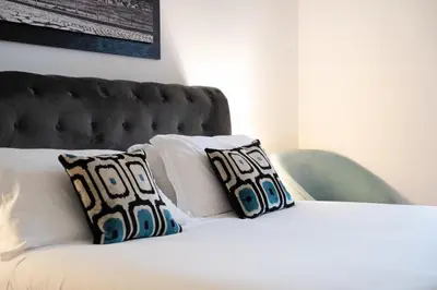 a bedroom with a bed and a picture on the wall at Colosseum superior suites in Rome