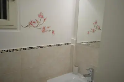 a bathroom with a sink and a mirror at Holiday home Zia Gina in Rome