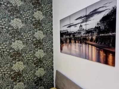 a wall with a picture of a bridge on a wall at Tiburtina Keys - Roma in Rome