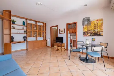 a living room with a table and chairs at Da Cecilia alla Piramide Cestia in Rome