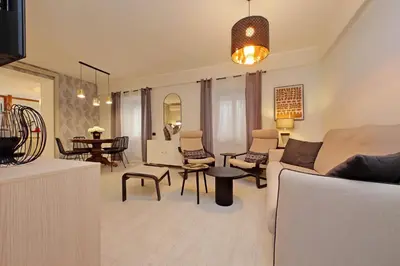 a living room with a couch and a table at 4BNB - Ponte Milvio Apartment in Rome