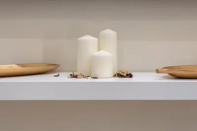 a table with three candles and a bowl on it at Colosseo Romantic Suite in Rome