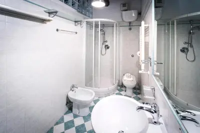 a bathroom with a toilet and a shower and a sink at maison pelliccia in Rome
