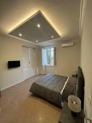 a bedroom with a large bed in a room at Apartment V12 in Rome