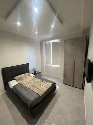 a bedroom with a large bed in a room at Apartment V12 in Rome