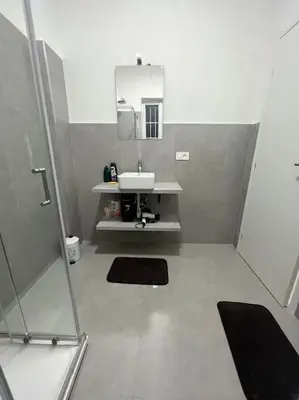 a bathroom with a sink and a mirror at Apartment V12 in Rome