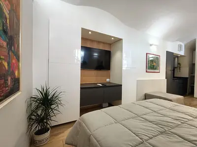 a bedroom with a bed and a desk at viaCatania16 in Rome