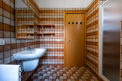 a bathroom with a sink and a toilet at Leoncavallo Retreat in Rome