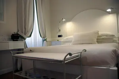 a hospital bed in a room with a window at Suite Fontana di Trevi in Rome