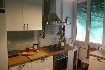 a kitchen with a stove and a counter top at Porta Maggiore Modern Apartment in Rome