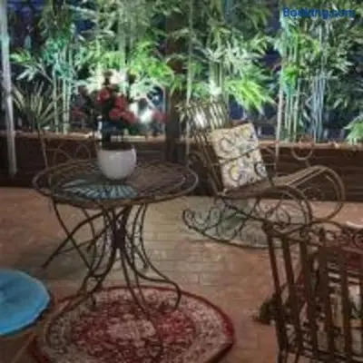 a living room with a table and chairs and a couch at Lovely Terrace Aurelia in Rome