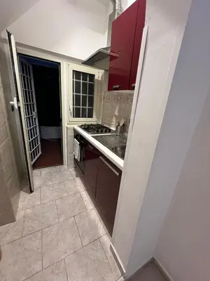 a kitchen with a sink and a stove at centro stazione tuscolana in Rome