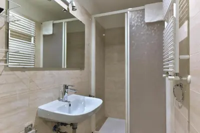 a bathroom with a sink and a shower at Best Rooms Termini in Rome