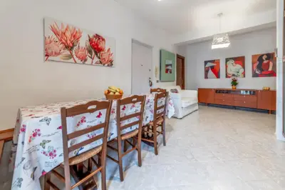 a kitchen and dining room with a table and chairs at Luisa Flat - Metro Basilica San Paolo - Wi-Fi in Rome