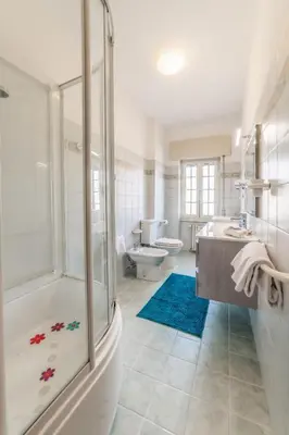 a bathroom with a shower and a sink and a toilet at Luisa Flat - Metro Basilica San Paolo - Wi-Fi in Rome