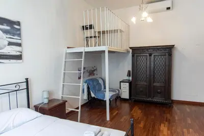 a bedroom with a book shelf and a bed at A due passi dal Vaticano in Rome