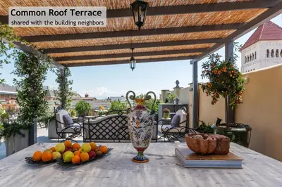 a vase sitting on top of a table with fruit at Toscana 6 - FromhometoRome in Rome
