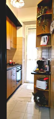 a kitchen with a sink and a stove and a window at A casa di chi, Family, Near Metro in Rome
