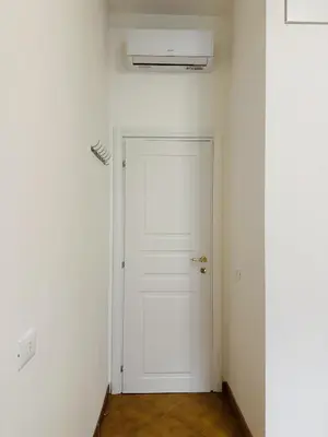 a white door in a room with a white wall at Greg Roma in Rome