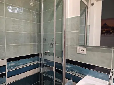 a bathroom with a shower and a toilet at Greg Roma in Rome