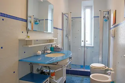 a bathroom with a sink and a shower and a toilet at Valerio’s House in Rome