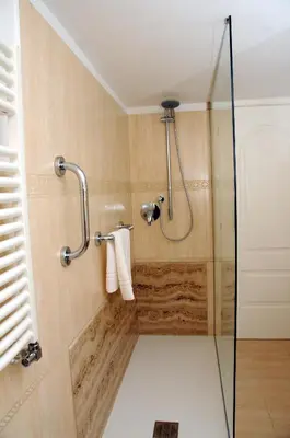 a shower with a glass door in a bathroom at A Casa di Lu, al Colosseo - Guest House in Rome