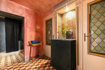 a hallway with a black dresser in a room at Farnese Designer Loft by Romeloft in Rome
