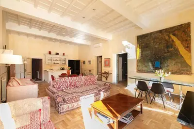 a living room with a couch and a table at Farnese Designer Loft by Romeloft in Rome