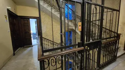 a large cage with blue birds inside of it at Light Blue Station Apartment in Rome
