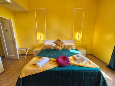 a bedroom with a bed with two towels on it at Residenze Serventi Longhi in Rome