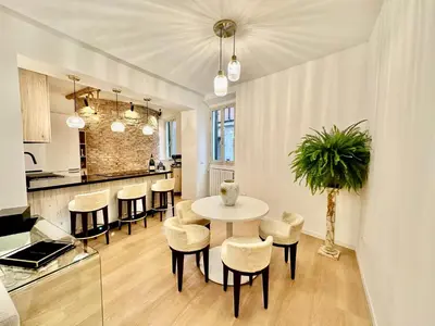 a kitchen and dining room with a table and chairs at In the shadow of the Colosseum in Rome