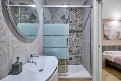 a bathroom with a sink and a shower at Casa Pallini Luxury Apartment in Rome