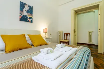 a bedroom with a bed with towels on it at Suite Apartment Prati in Rome
