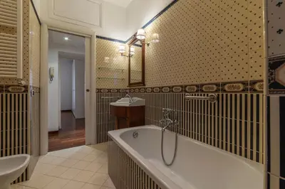 a bathroom with a tub and a sink at GuestHost - A due passi da Santa Maria Maggiore Apartment in Rome