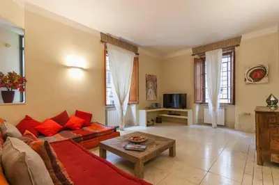 a living room with a couch and a table at BORGO PIO - quite and spacious apt in Rome