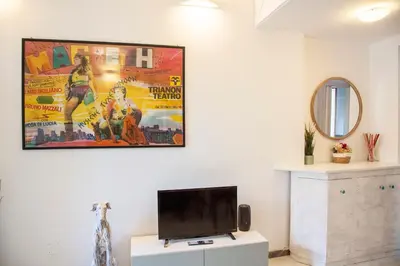 a living room with a flat screen tv on a wall at Ton Ton by Ghor in Rome