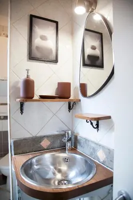 a bathroom with a sink and a mirror at Ton Ton by Ghor in Rome