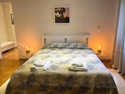a bedroom with a bed with towels on it at La Casa Libre Metro A Colli Albani 350 m in Rome