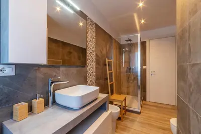a bathroom with a sink and a shower at GuestHost - Valle Aurelia Elegant Apartment in Rome