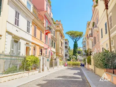 a street in the city with a tree in the distance at Azadi B&B Flaminio in Rome
