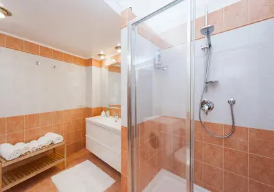 a bathroom with a shower with a glass door at Residenza dei Pontefici in Rome