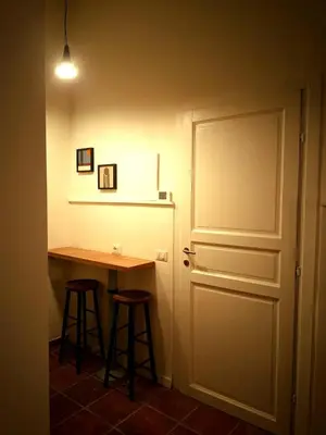 a room with a table and a door and a desk at Flaminia's House San Pietro Station in Rome