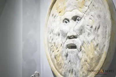 a sculpture of a face on a wall at Domus Alberti Bed & Breakfast in Rome