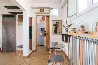 a kitchen with a glass table and some chairs at cos24 in Rome