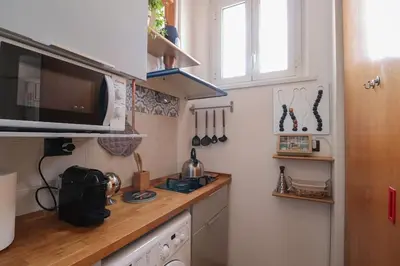 a small kitchen with a counter and a microwave at cos24 in Rome