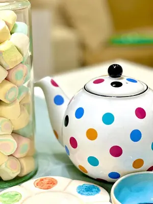 a polka dot teapot next to a jar of candy at Olimpia Villa Pamphili - Centro Storico di Roma - Gianicolo Trastevere San Pietro in Rome