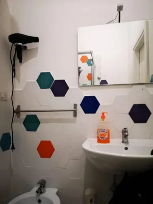 a bathroom with a sink and a mirror at Casa Manzoni in Rome