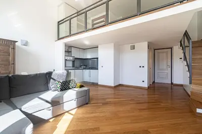 a living room with a couch and a kitchen at [Trastevere Lux* * * * *] - Roma Centro Storico in Rome
